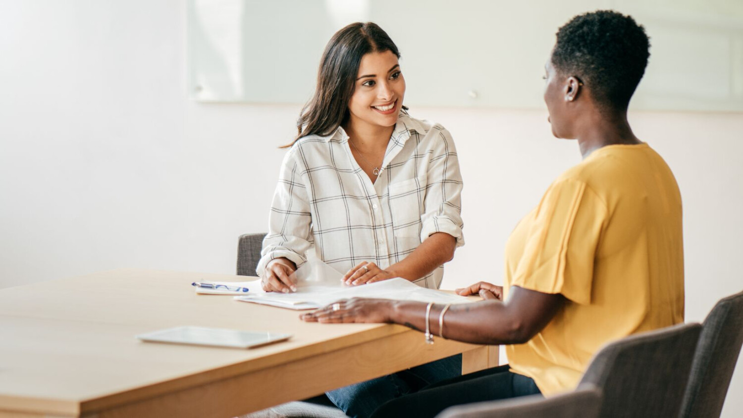 two-women-in-interview-at-table