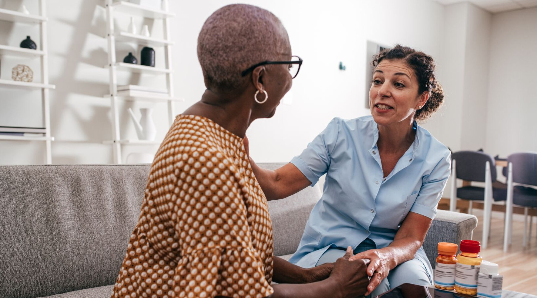 female-caregiver-speaks-with-female-client