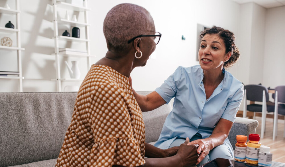 female-caregiver-speaks-with-female-client