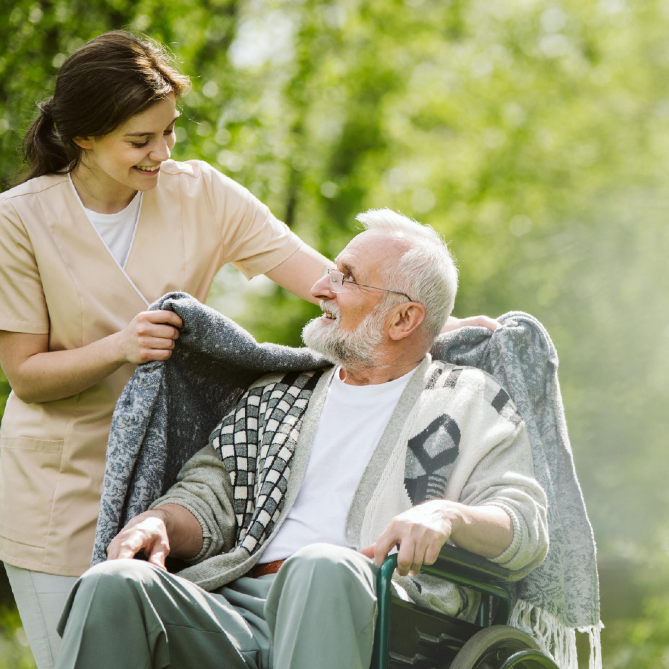 woman-caregiver-with-a-man-in-a-wheelchair