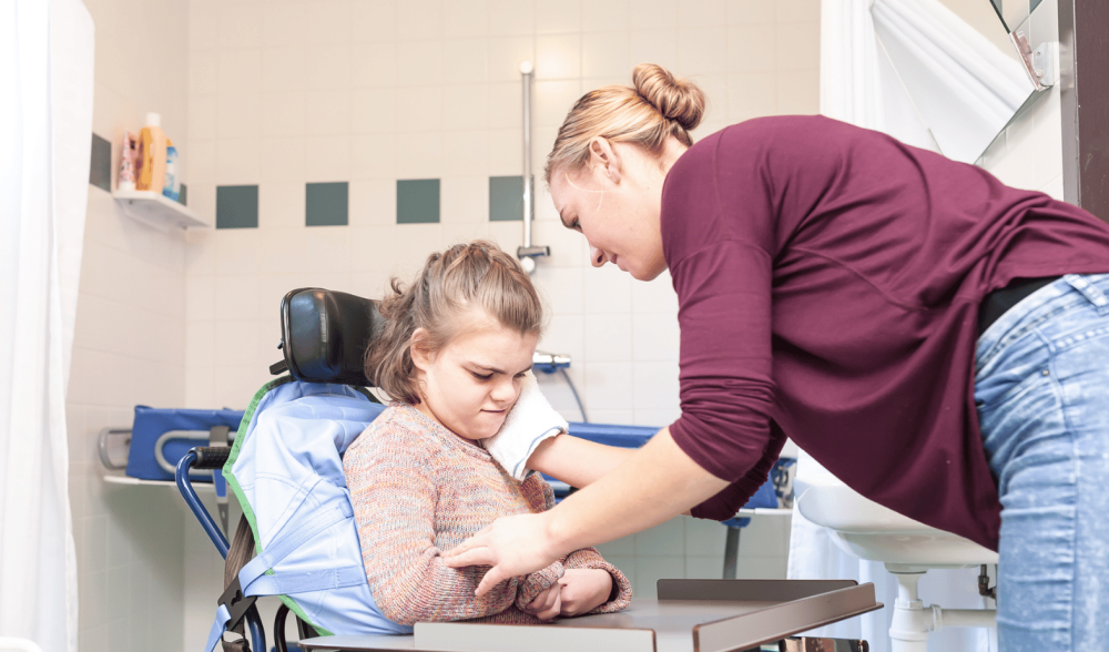 Carer looking after a person with a disability