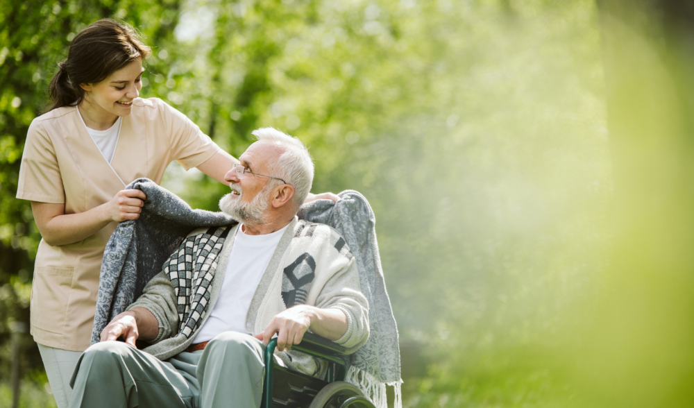 woman-caregiver-with-a-man-in-a-wheelchair