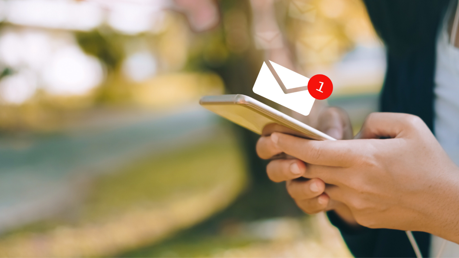 hands holding a mobile phone with email notification