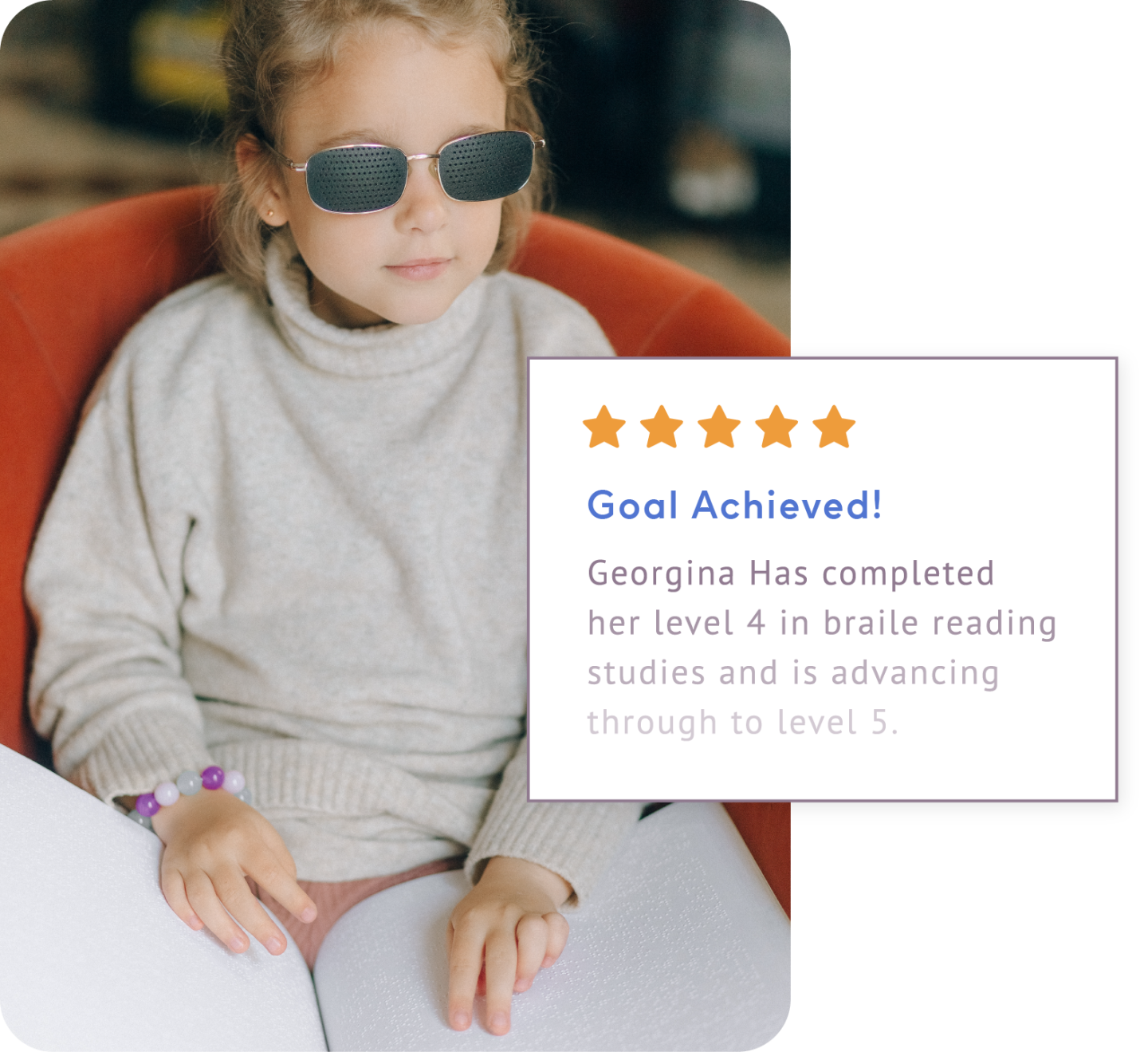 Young, blind girl with ShiftCare notification showing she has reached her goal in Level 4 Braille