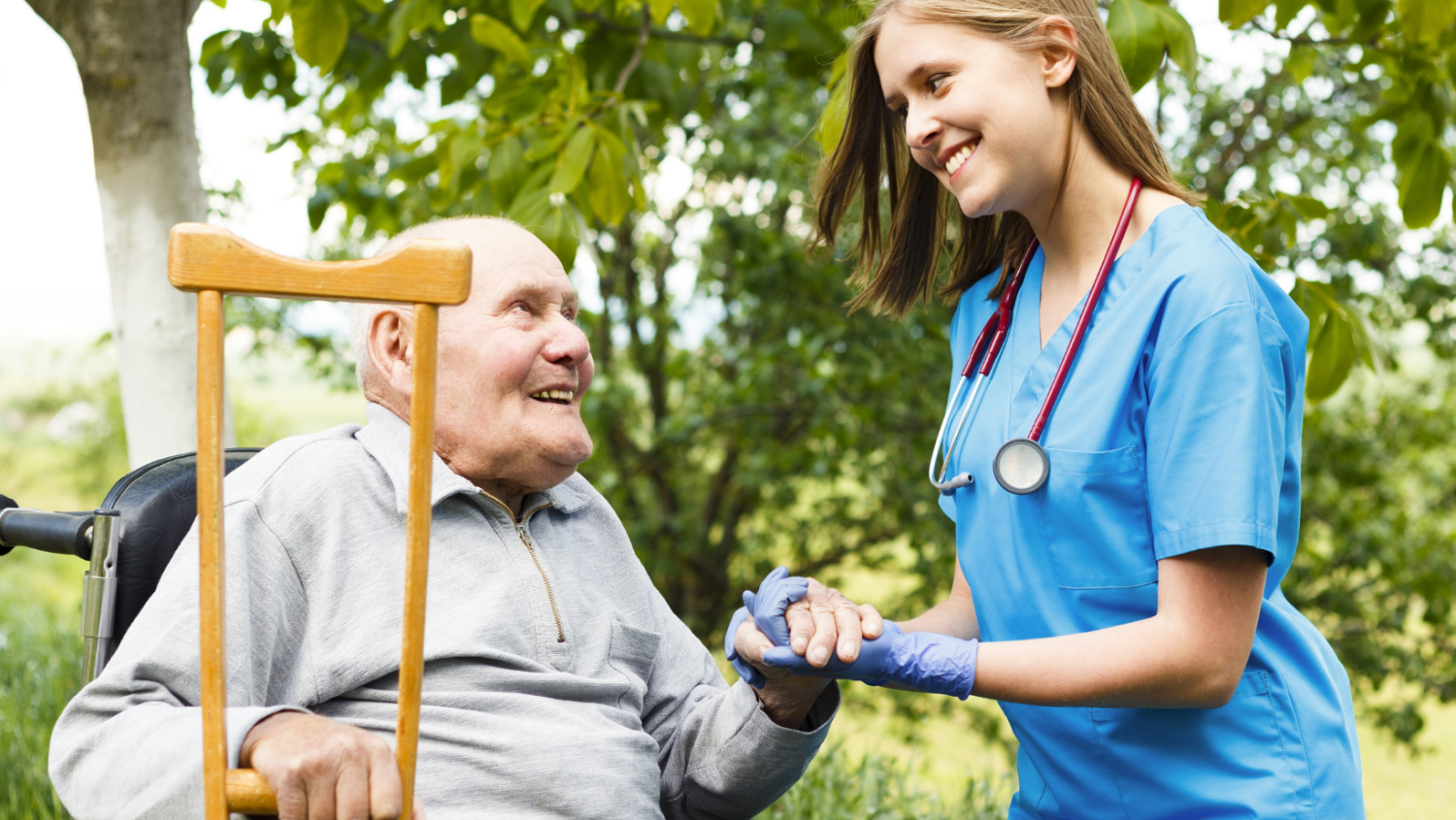 caregiver-helps-man-in-wheelchair